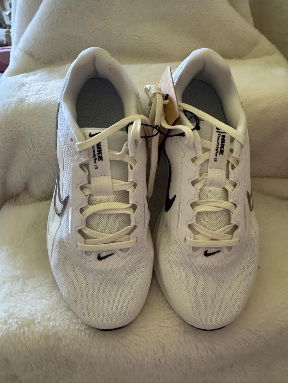 Nike White Athletic Sneakers with Black Swoosh